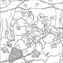 Ponies catching butterflies coloring page