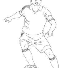Soccer player dribbling coloring page