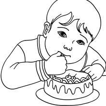 Boy eating a birthday cake coloring page