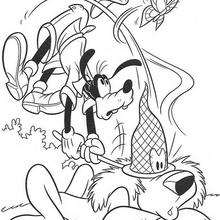 Goofy catching butterflies coloring page